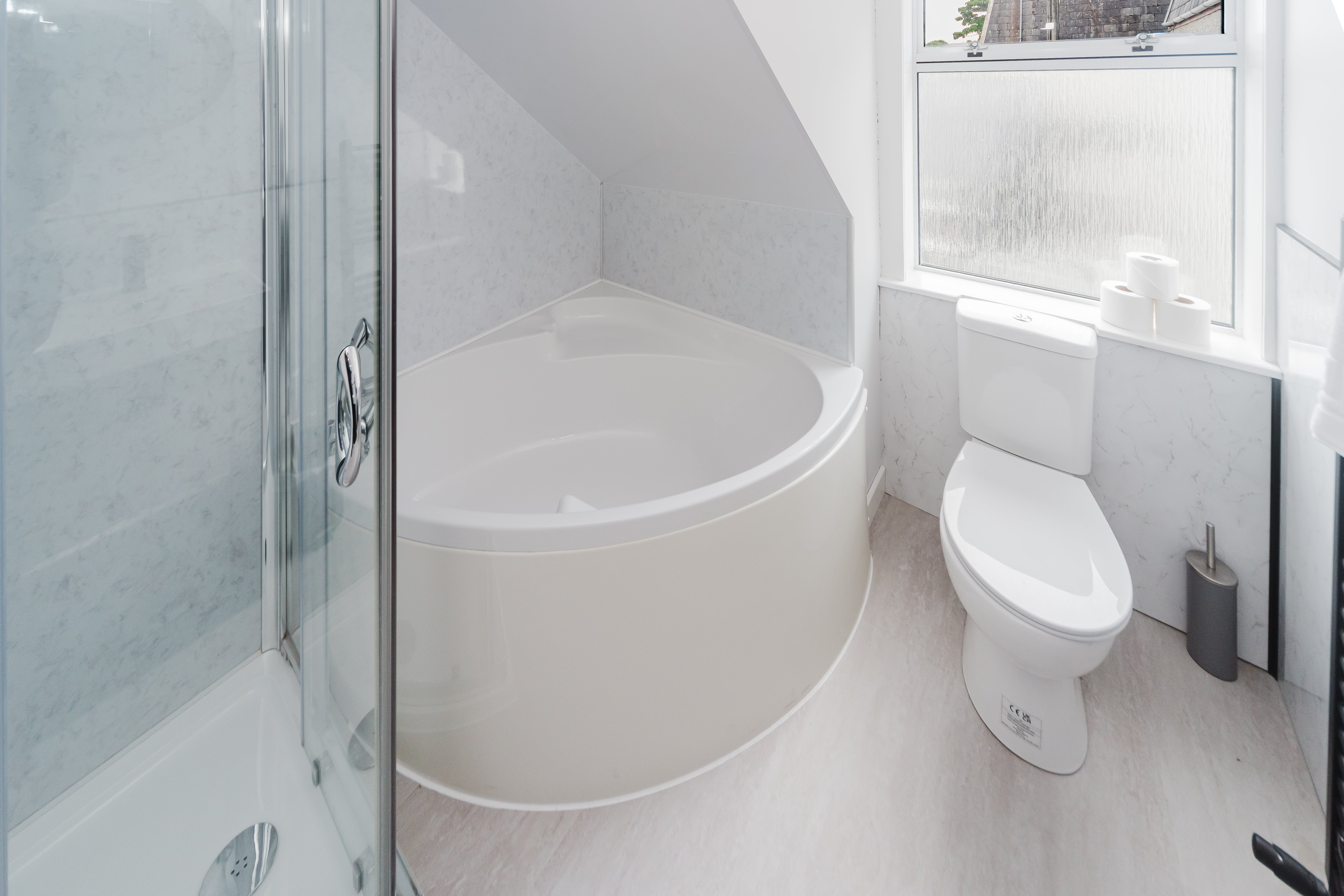 Bathroom with corner bath