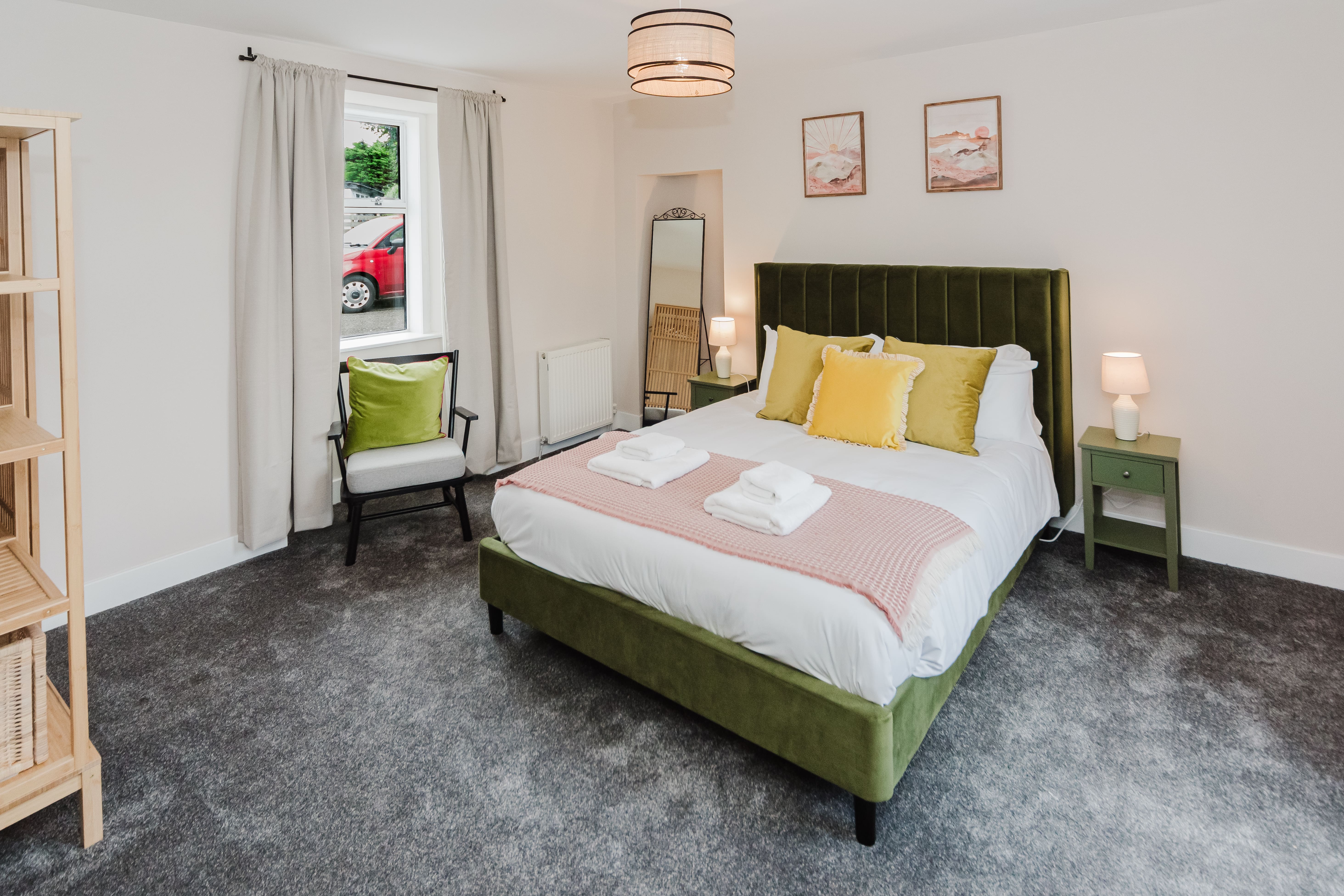 Double bedroom with green headboard