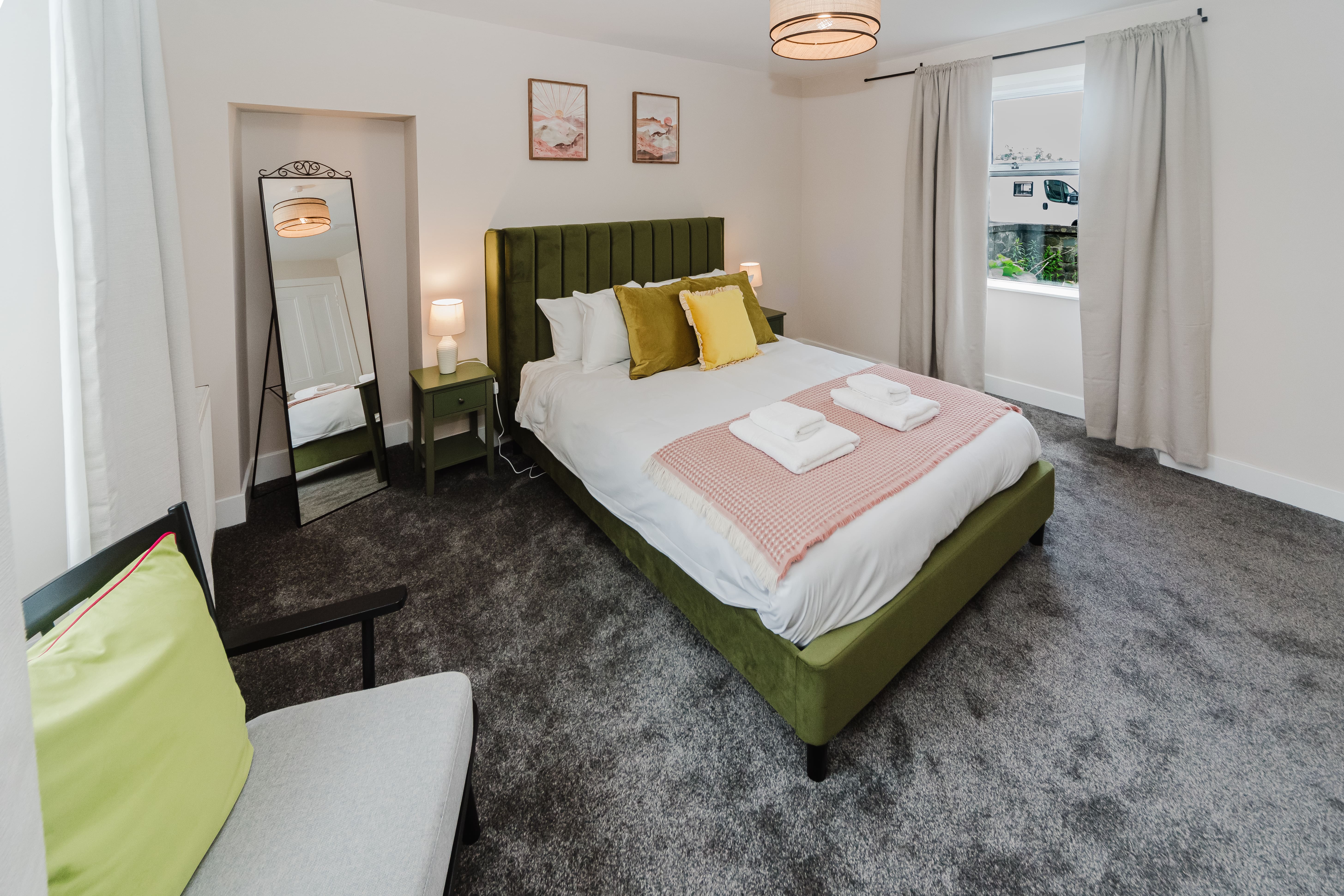 Double bedroom with green headboard