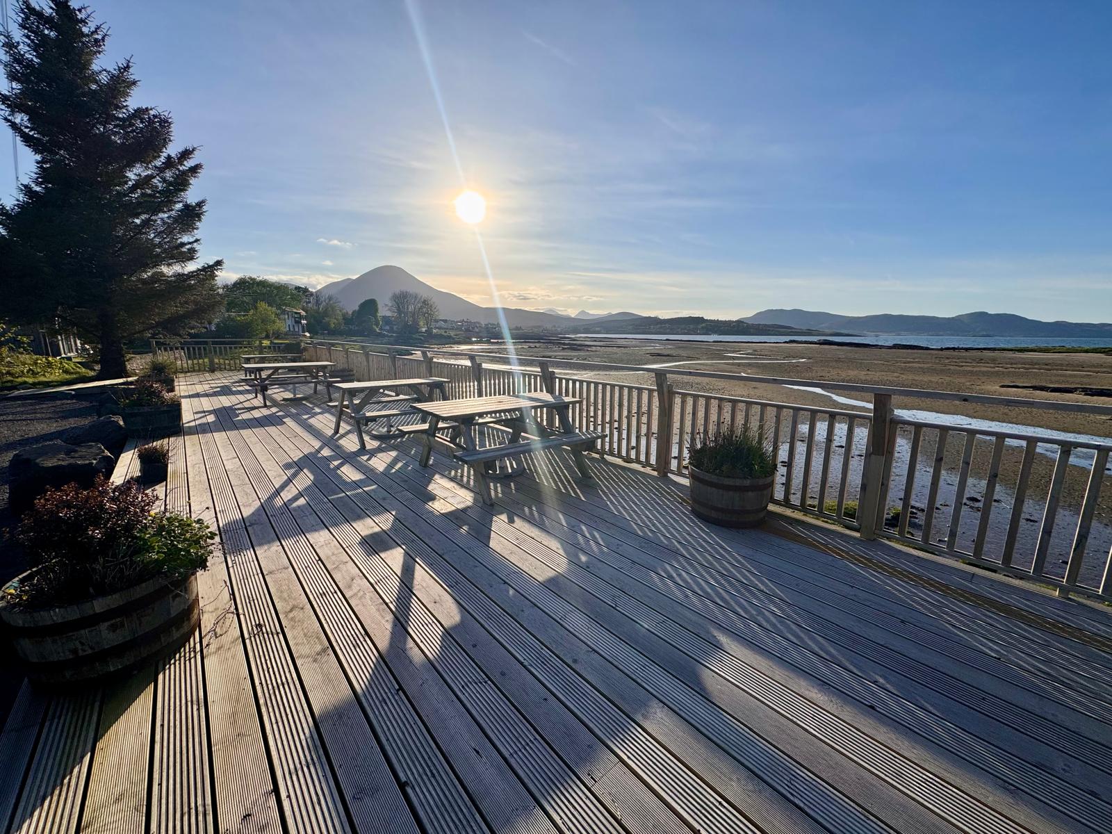 Decking with sea and mountain views
